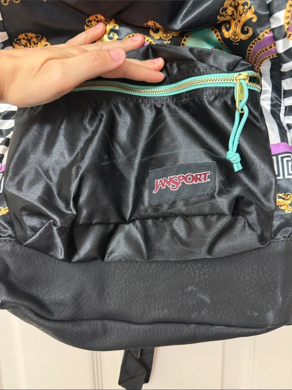 Jansport Black Backpack with Gold, Teal & Purple Accents